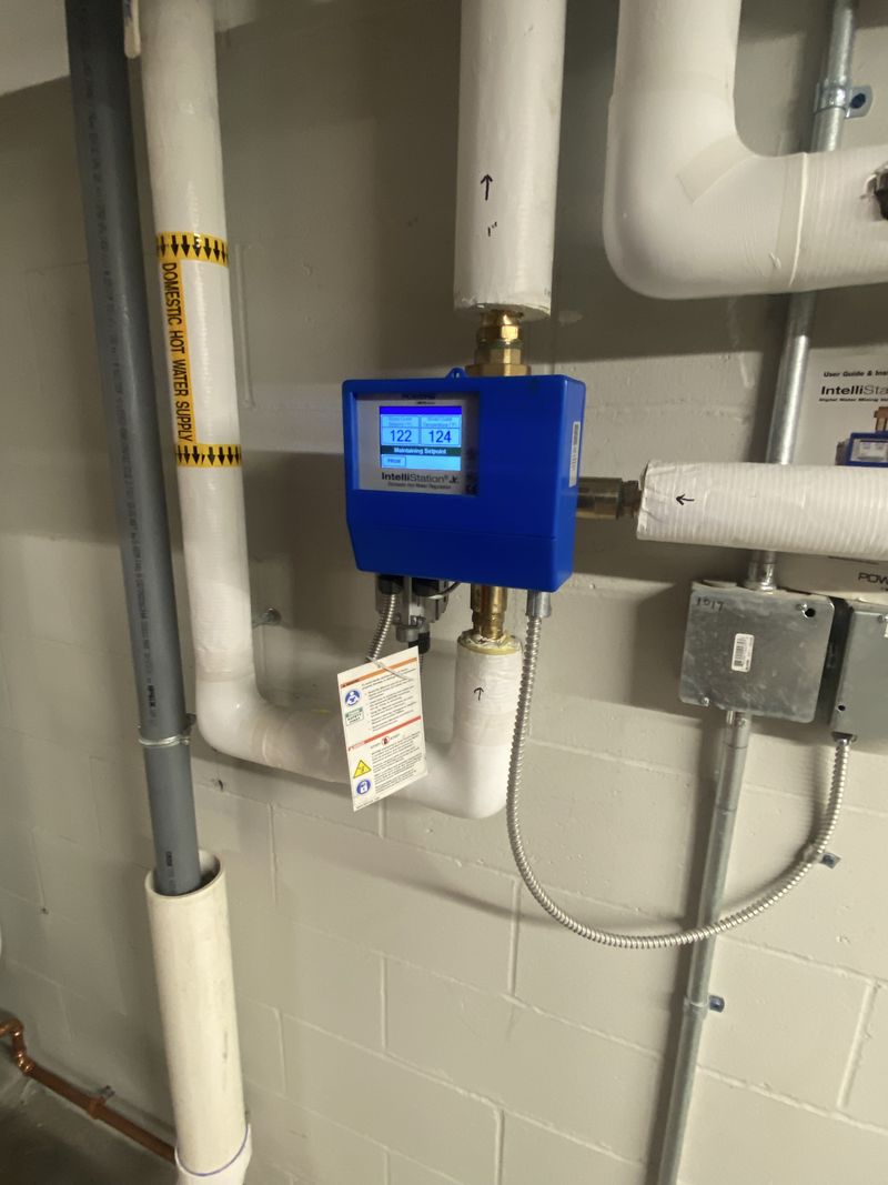 Digital hot water mixing valve installed on insulated domestic hot water piping