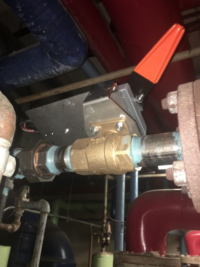 New motorized brass ball valve installed on mechanical piping